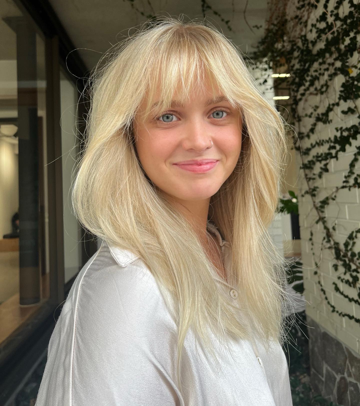 Long Wispy Haircut With Eyebrow Grazing Bangs